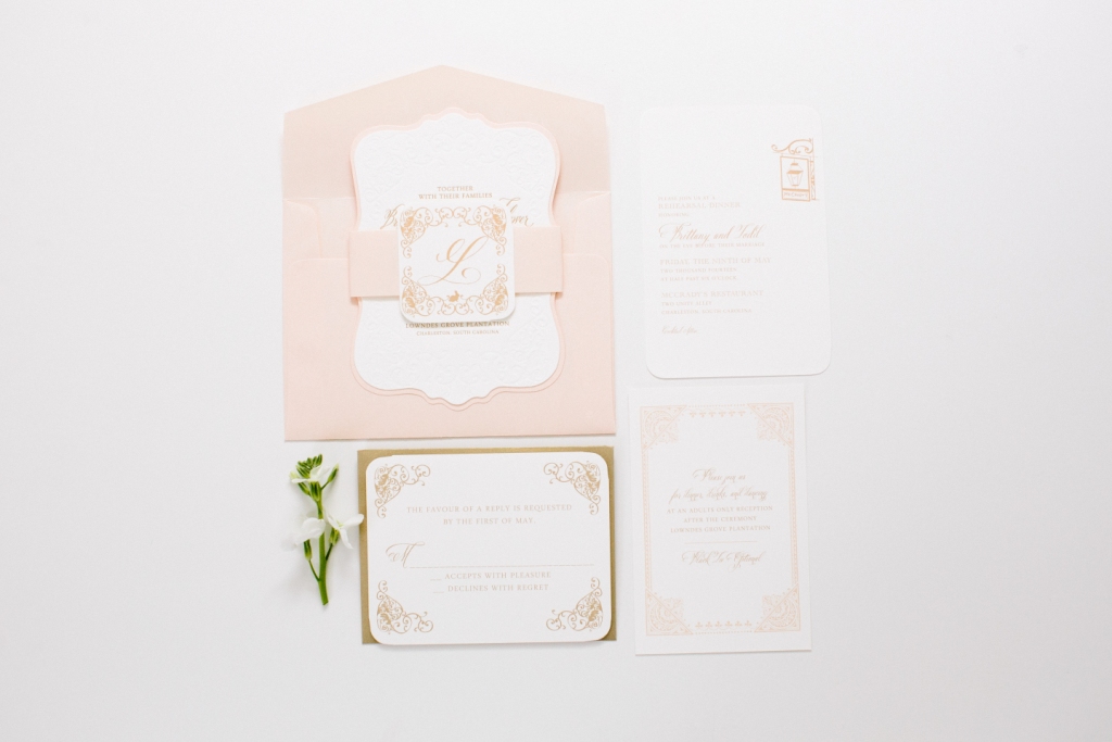 unique shape wedding invitation in blush and gold